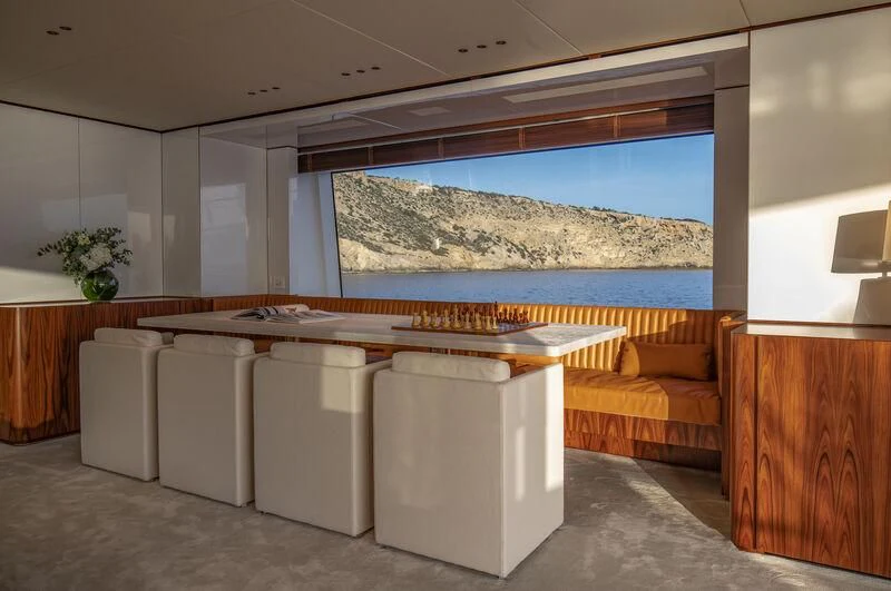a room with a large window aboard TOSUN Yacht for Sale