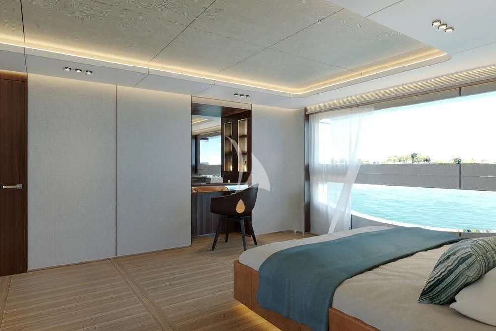 a room with a bed and a chair aboard TOSUN Yacht for Sale