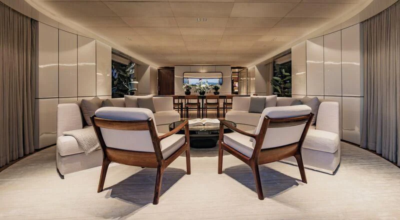 a room with chairs and a table aboard TOSUN Yacht for Sale