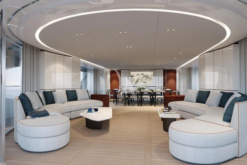 a living room with a large white couch and a large chandelier aboard TOSUN Yacht for Sale