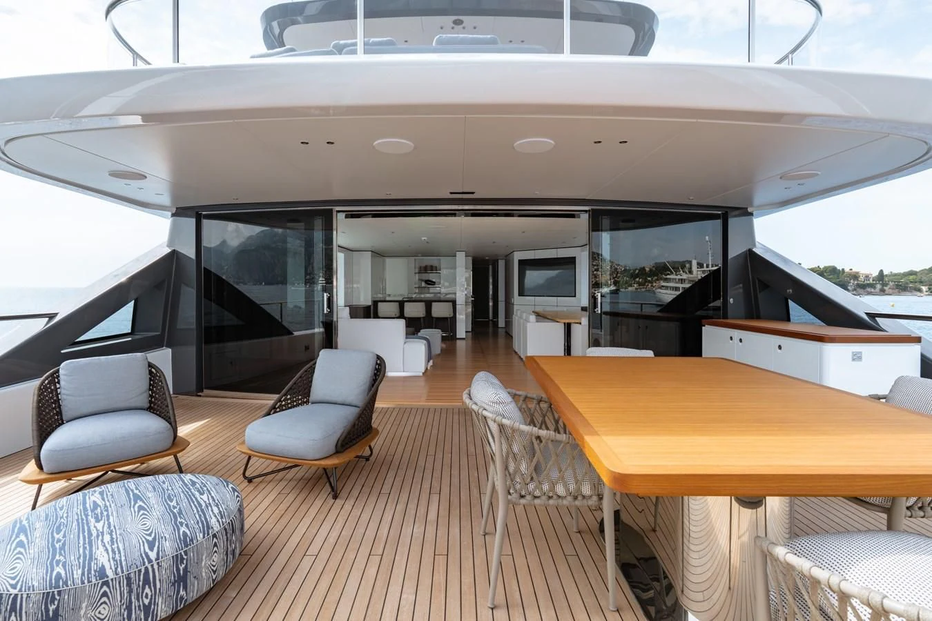 a room with a table and chairs aboard TOSUN Yacht for Sale
