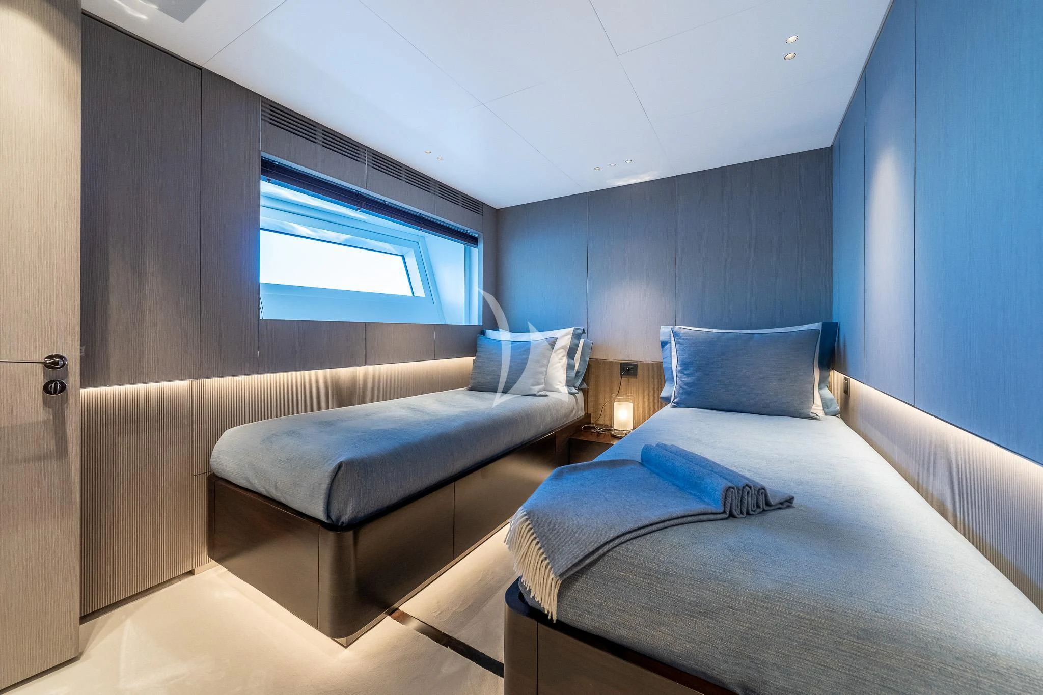 a room with a bed and a window aboard TOSUN Yacht for Sale