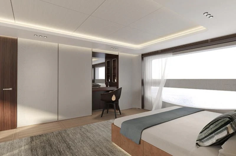a room with a bed and a desk aboard TOSUN Yacht for Sale