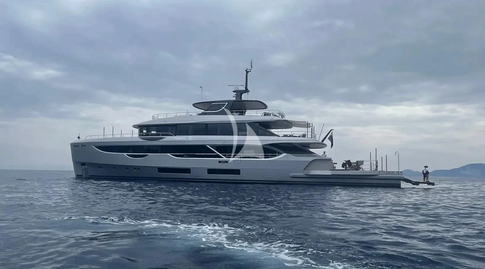 a white yacht in the water aboard TOSUN Yacht for Sale
