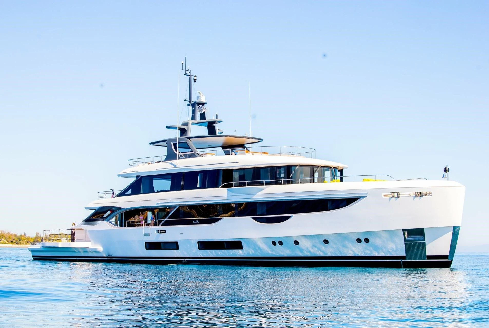 a large white boat on the water aboard TOSUN Yacht for Sale