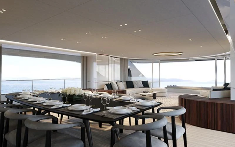 a dining room with a large table and chairs aboard TOSUN Yacht for Sale
