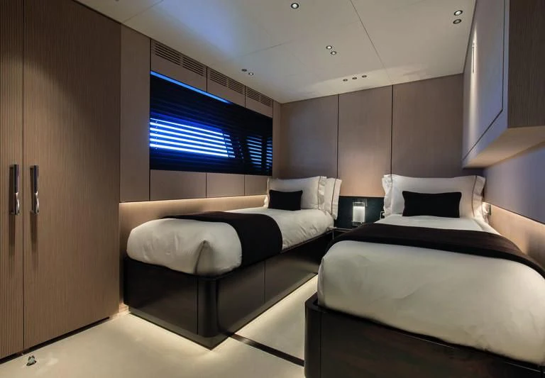 a room with two beds aboard TOSUN Yacht for Sale
