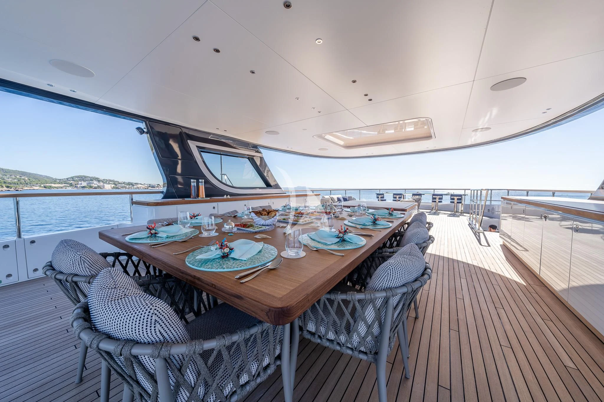 a table set for a meal on a boat aboard TOSUN Yacht for Sale