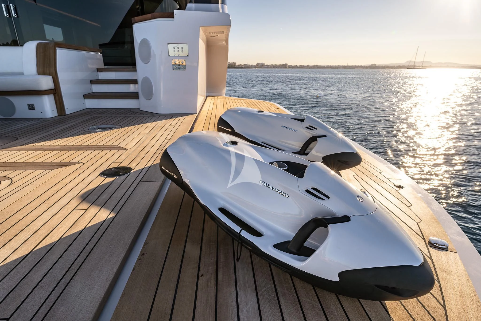 a white boat on a deck aboard TOSUN Yacht for Sale