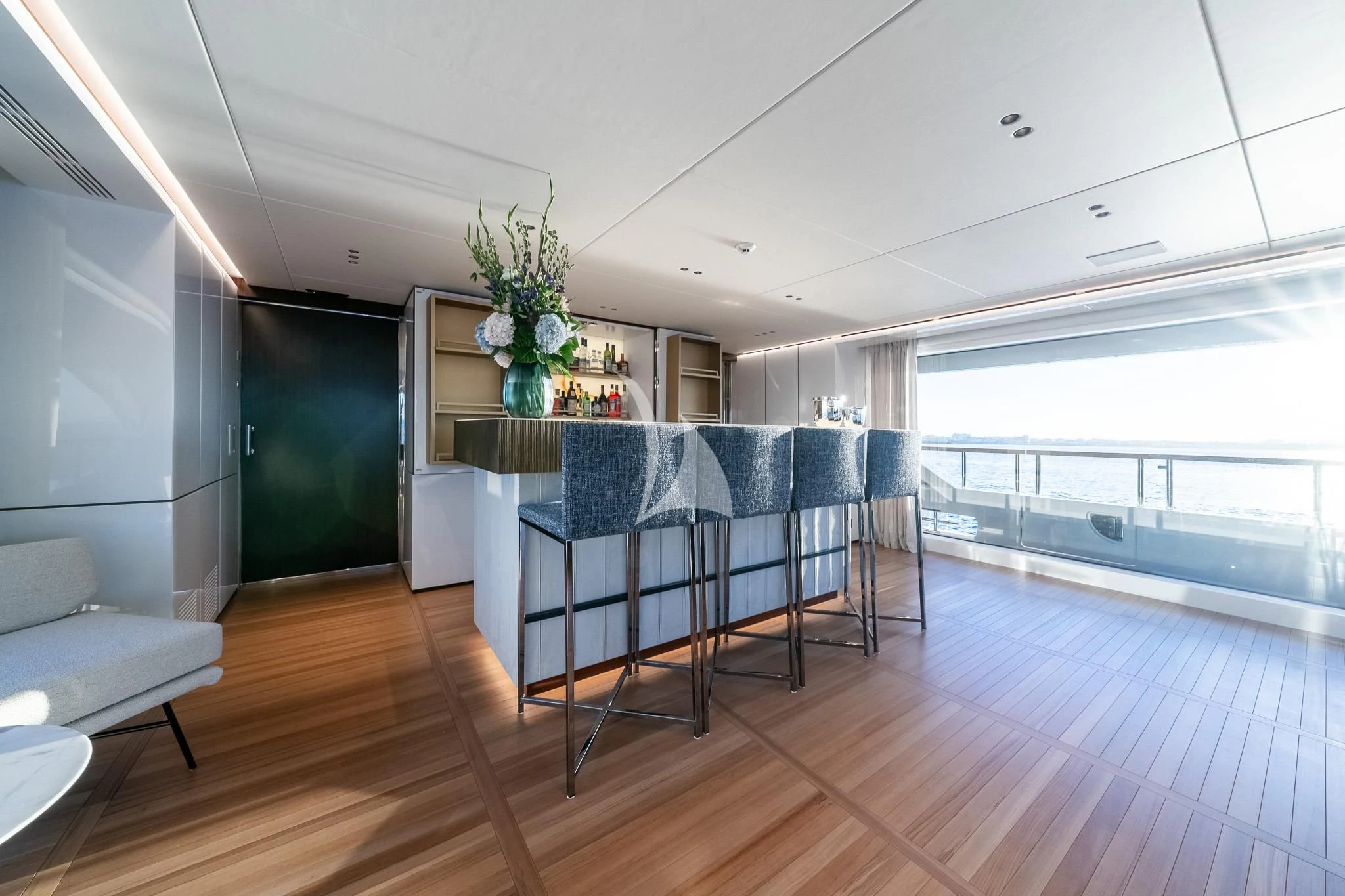 a room with a table and chairs aboard TOSUN Yacht for Sale