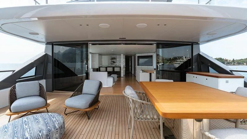 a room with a table chairs and a tv aboard TOSUN Yacht for Sale