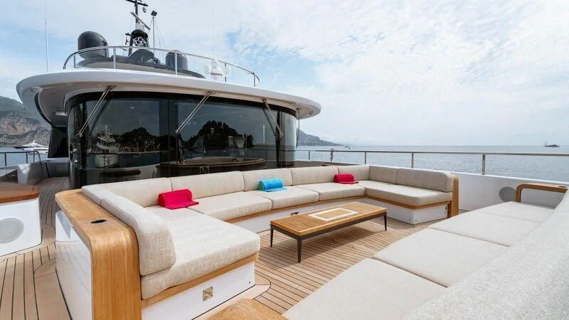a room with a couch and a table on a boat aboard TOSUN Yacht for Sale