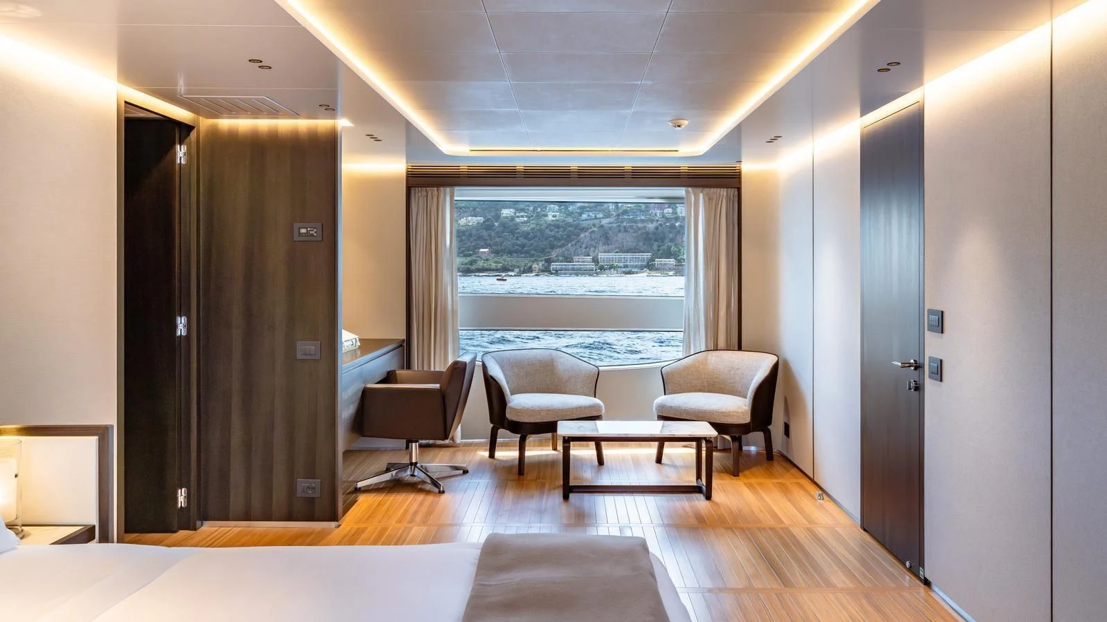 a room with a table chairs and a window aboard TOSUN Yacht for Sale