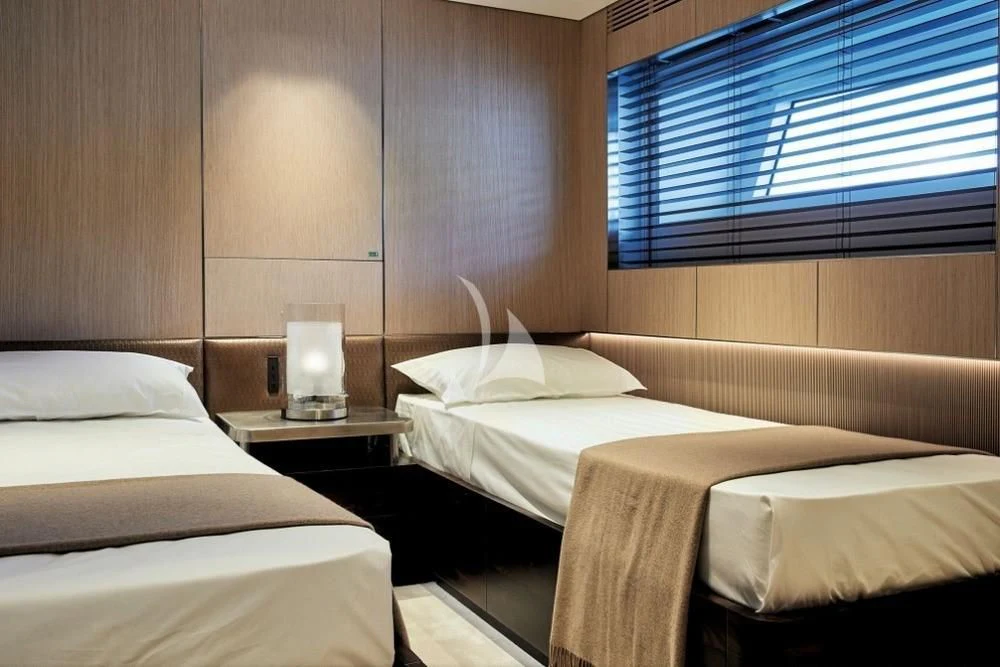 a room with two beds aboard TOSUN Yacht for Sale