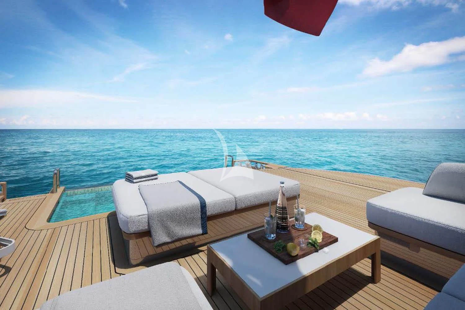 a table on a deck overlooking the ocean aboard TOSUN Yacht for Sale