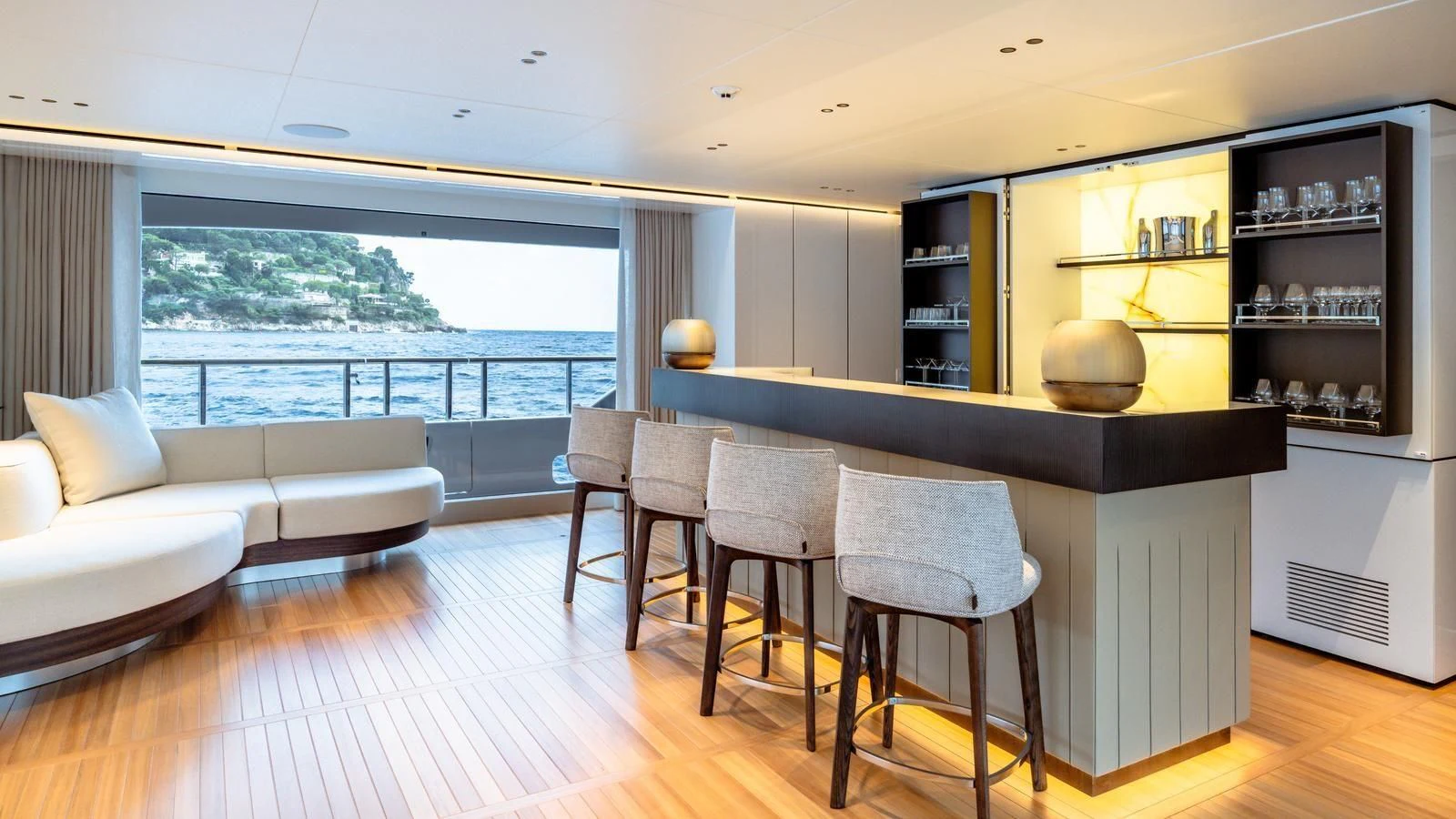 a living room with a large window aboard TOSUN Yacht for Sale