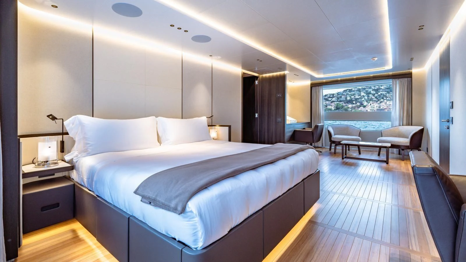 a large bedroom with a large bed aboard TOSUN Yacht for Sale