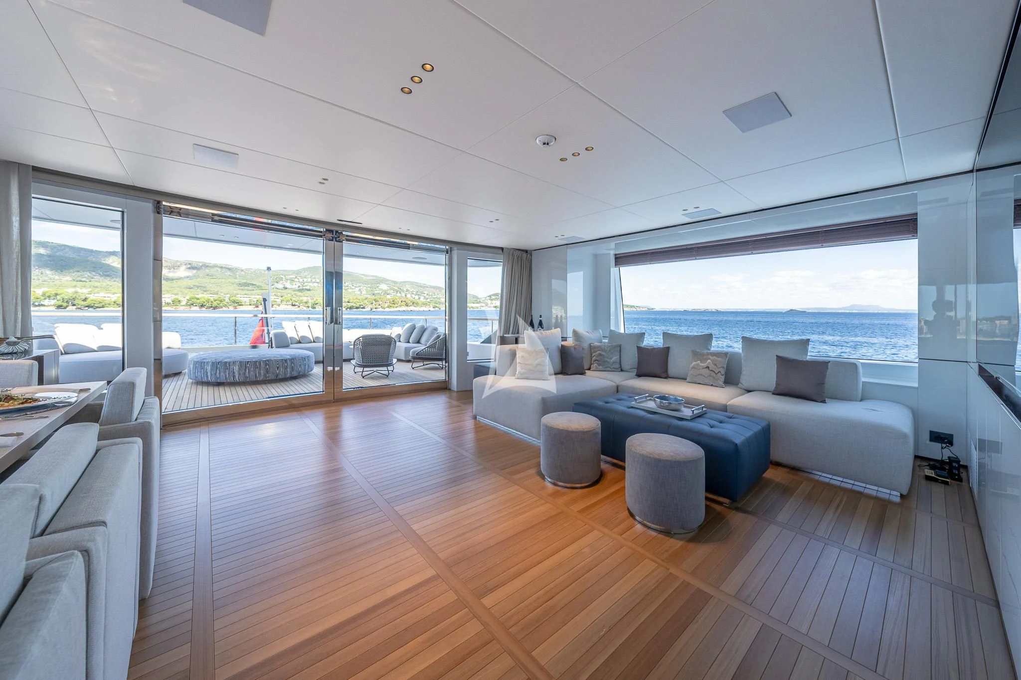a living room with a large window aboard TOSUN Yacht for Sale
