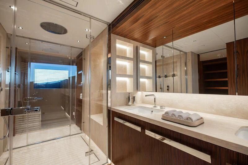 a bathroom with a large mirror aboard TOSUN Yacht for Sale