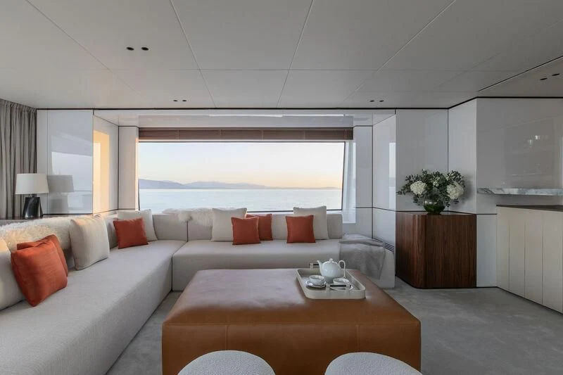 a living room with a large window aboard TOSUN Yacht for Sale