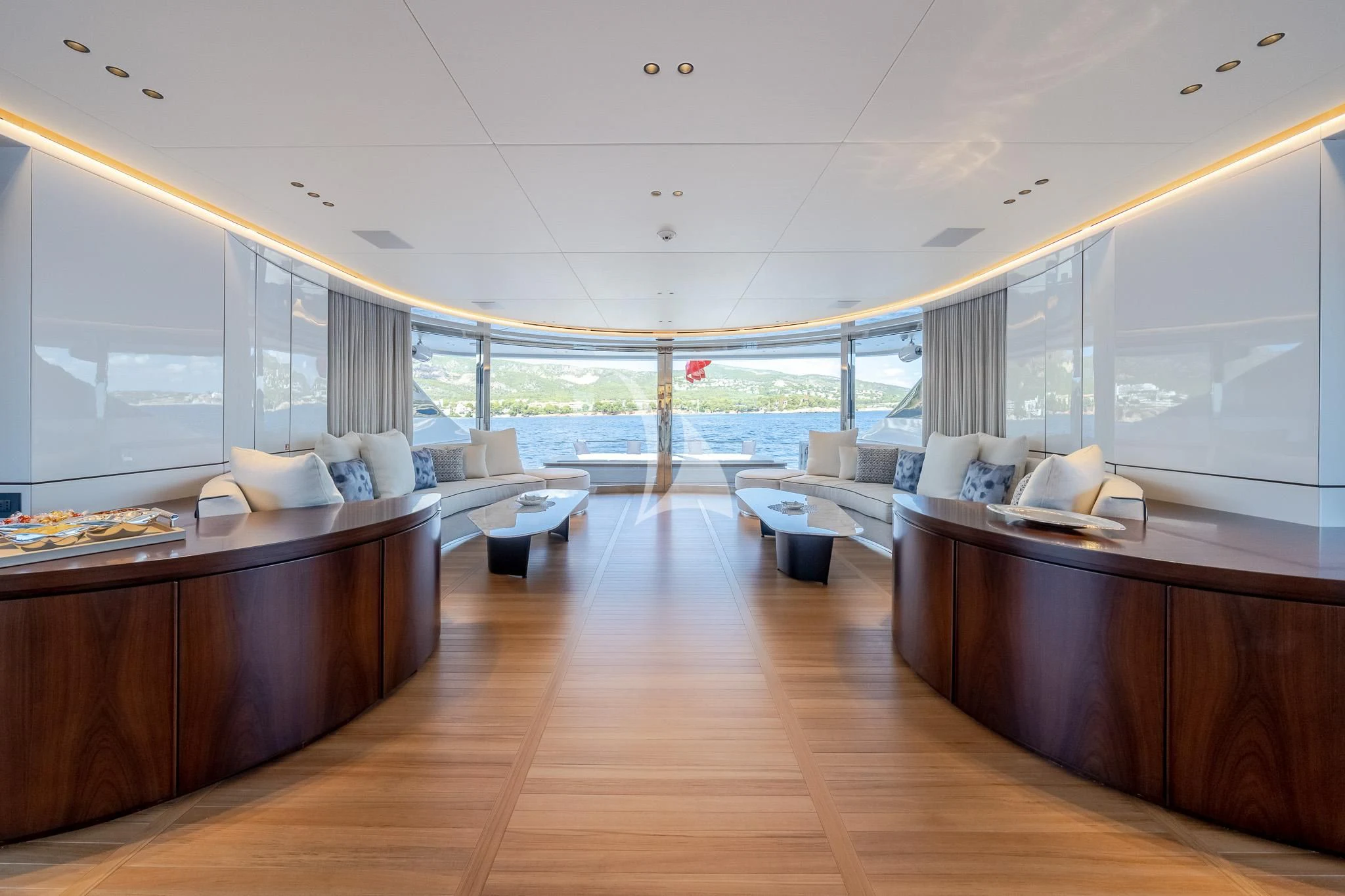 a room with a wood floor and a large window aboard TOSUN Yacht for Sale