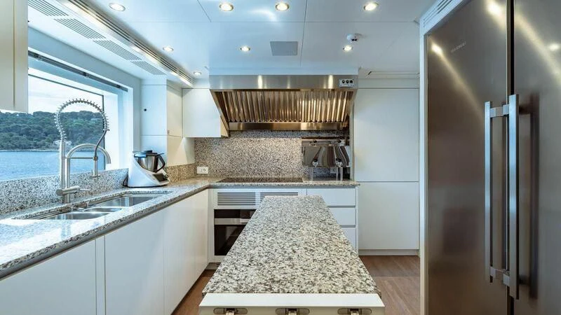 a kitchen with a marble counter top aboard TOSUN Yacht for Sale