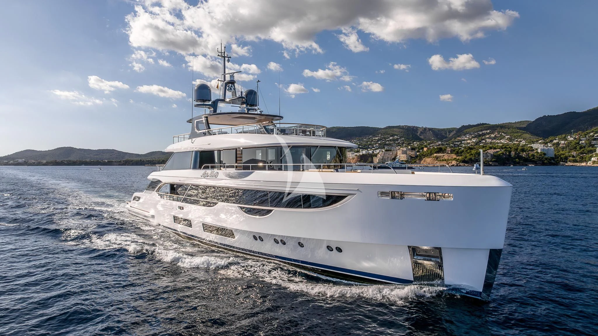 a white boat on the water aboard TOSUN Yacht for Sale