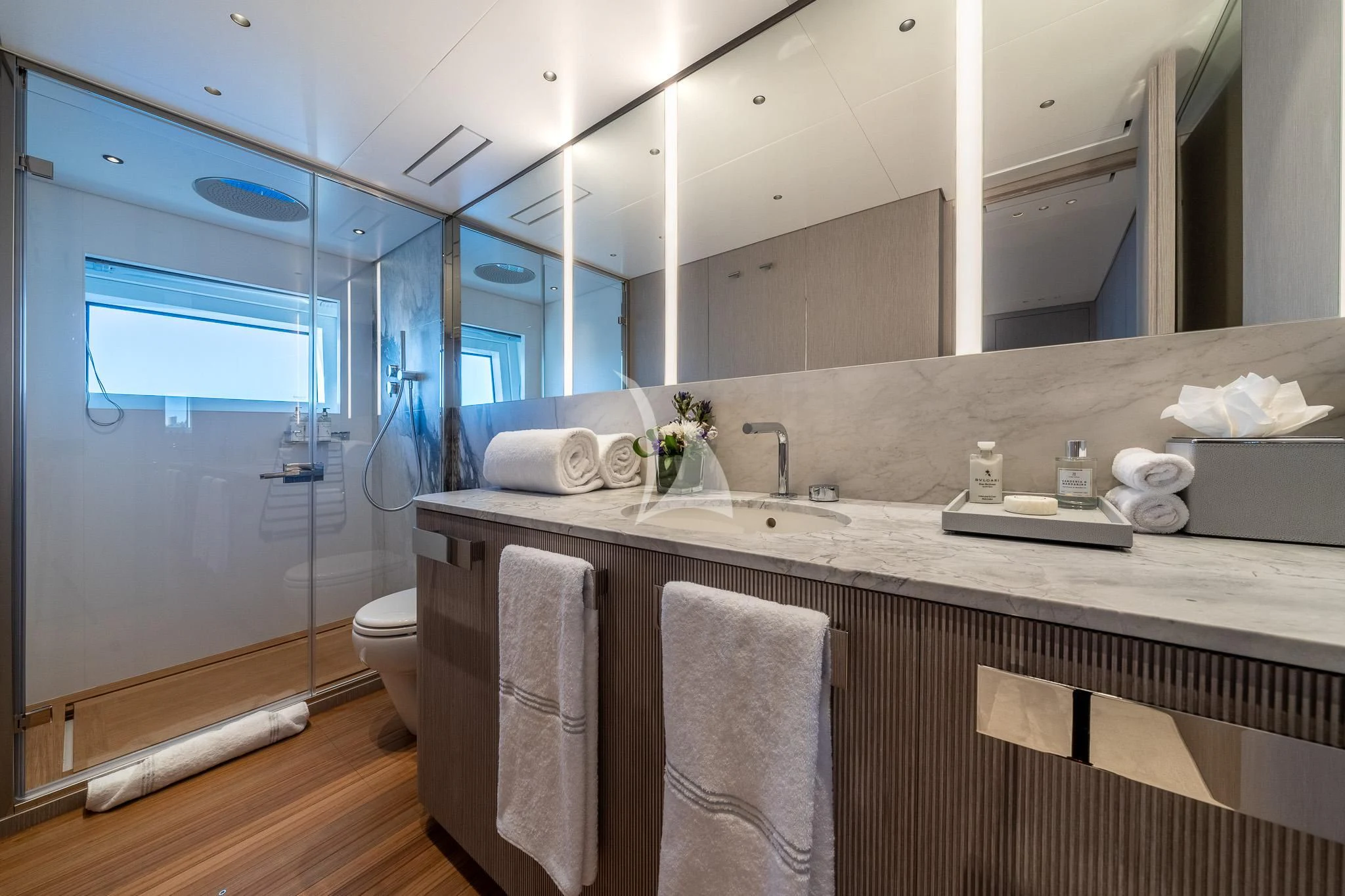 a bathroom with a large mirror aboard TOSUN Yacht for Sale