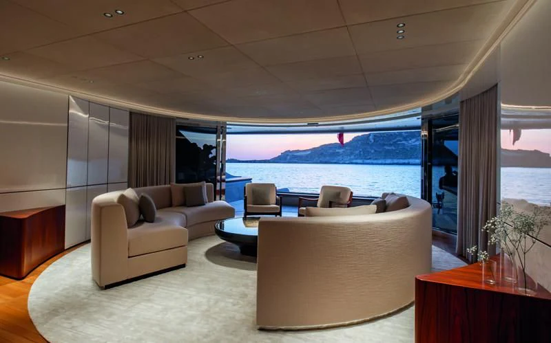 a room with a large window and a view of the ocean aboard TOSUN Yacht for Sale