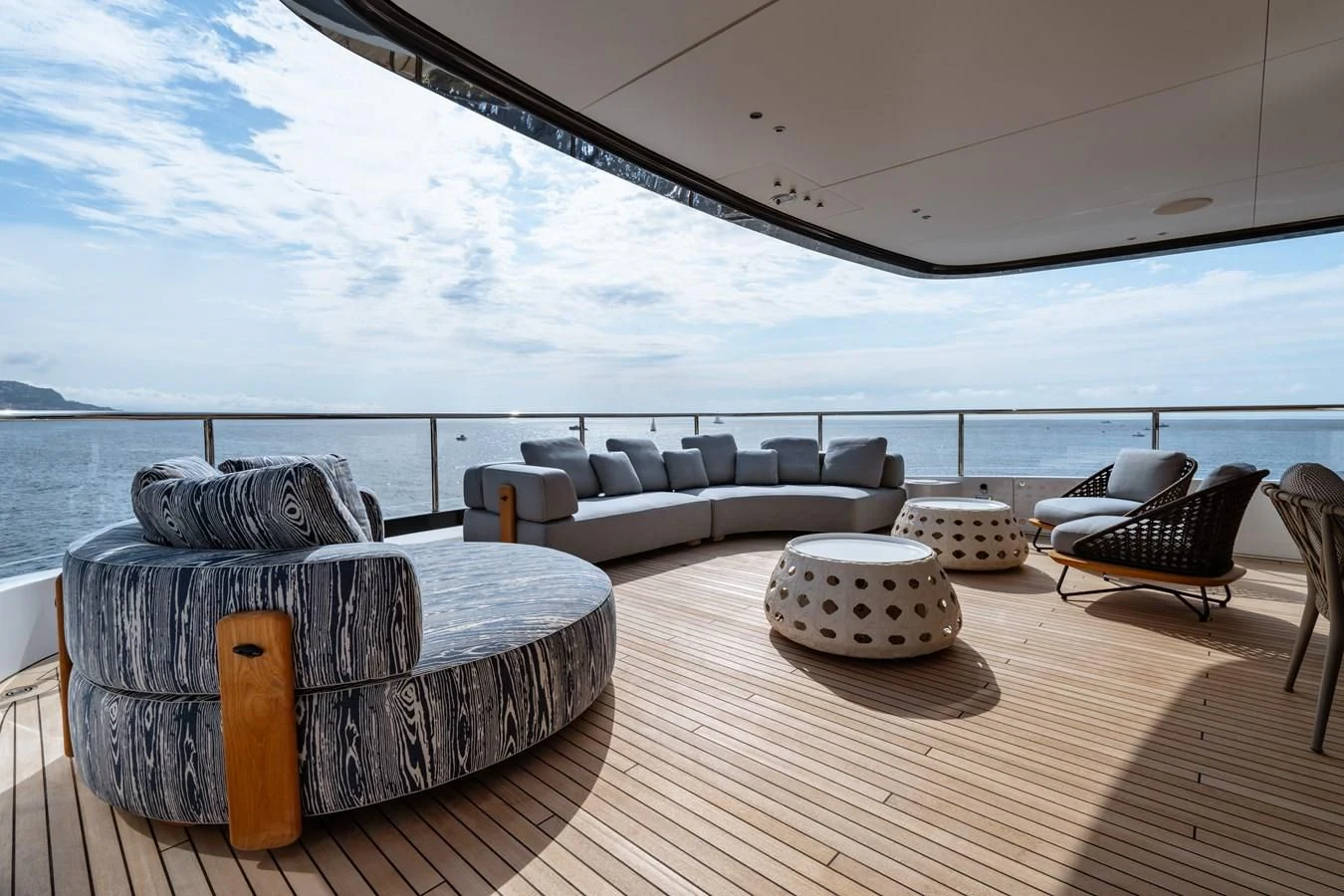a large living room with a large balcony overlooking the ocean aboard TOSUN Yacht for Sale