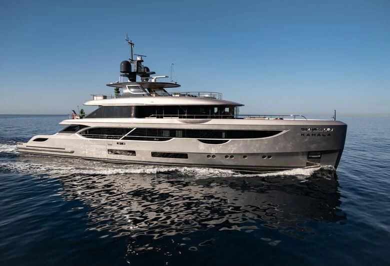 a large white boat on the water aboard TOSUN Yacht for Sale