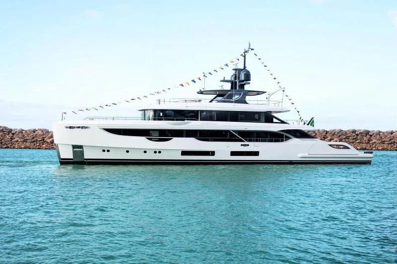 a large white boat in the water aboard TOSUN Yacht for Sale