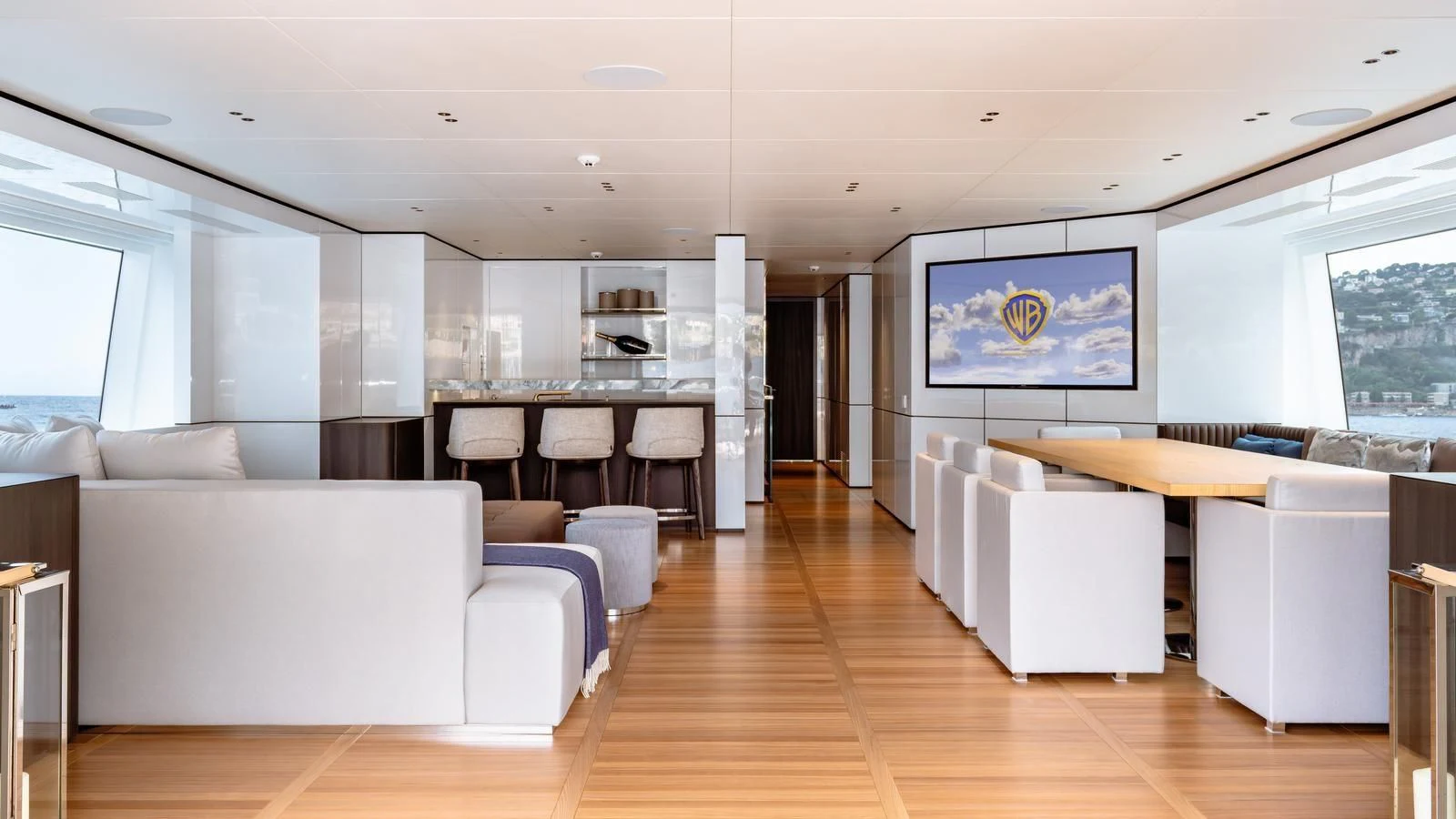 a large living room with white furniture aboard TOSUN Yacht for Sale