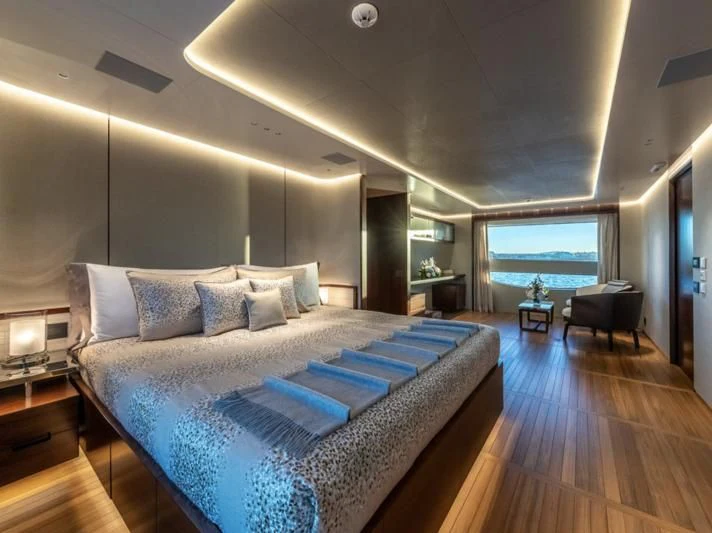 a large bed in a room aboard TOSUN Yacht for Sale