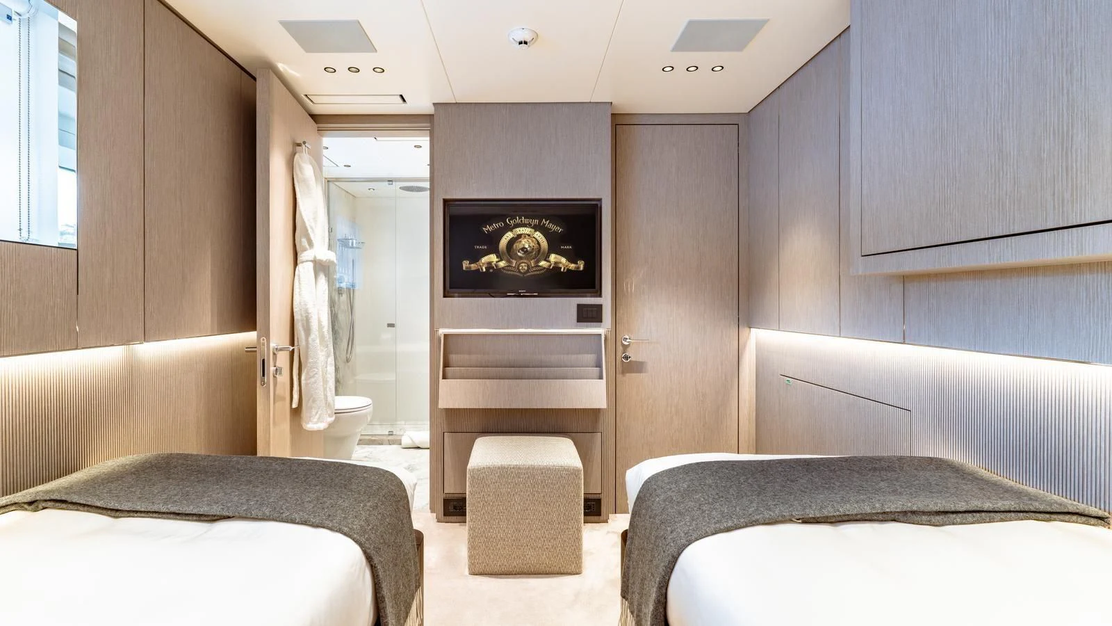 a room with a bed and a fireplace aboard TOSUN Yacht for Sale