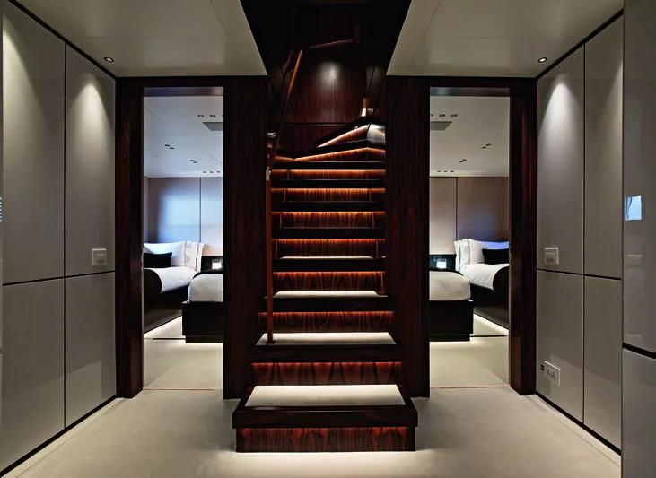 a room with a bed and a mirror aboard TOSUN Yacht for Sale