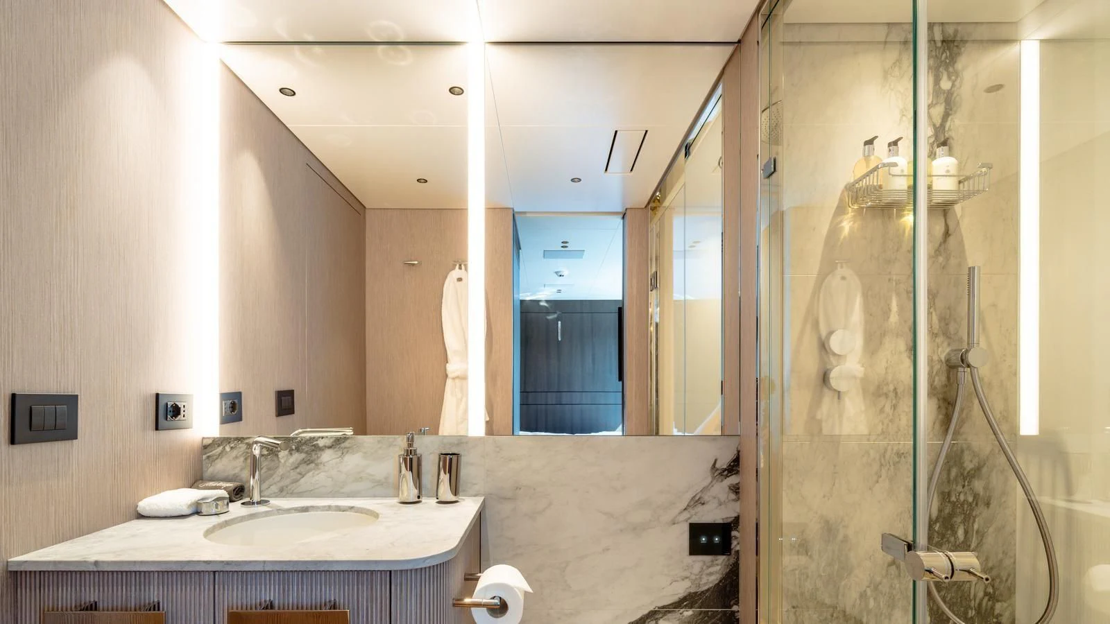 a bathroom with a countertop sink and mirror aboard TOSUN Yacht for Sale