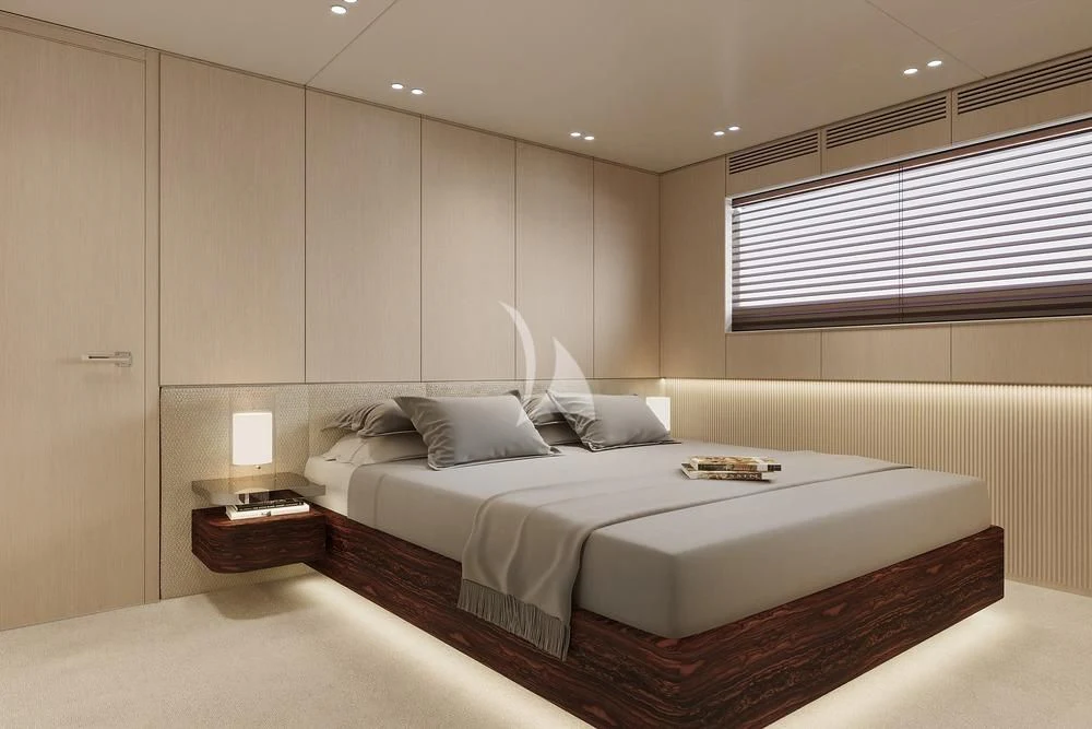 a room with a bed and a window aboard TOSUN Yacht for Sale