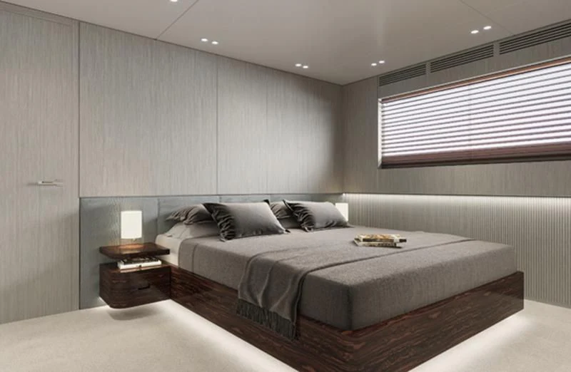 a room with a bed and a table aboard TOSUN Yacht for Sale