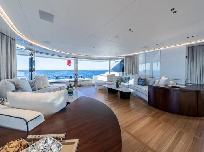 a living room with a large balcony aboard TOSUN Yacht for Sale