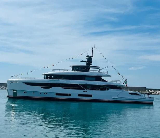 a white yacht in the water aboard TOSUN Yacht for Sale