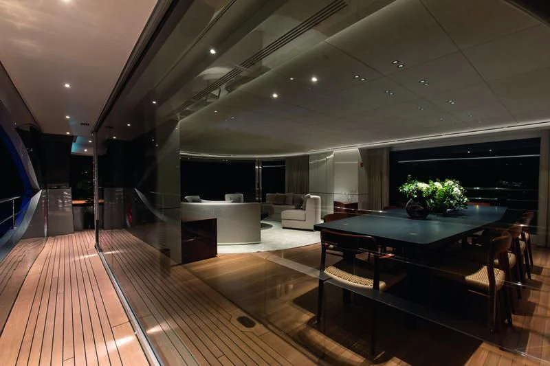 a room with a table and chairs aboard TOSUN Yacht for Sale
