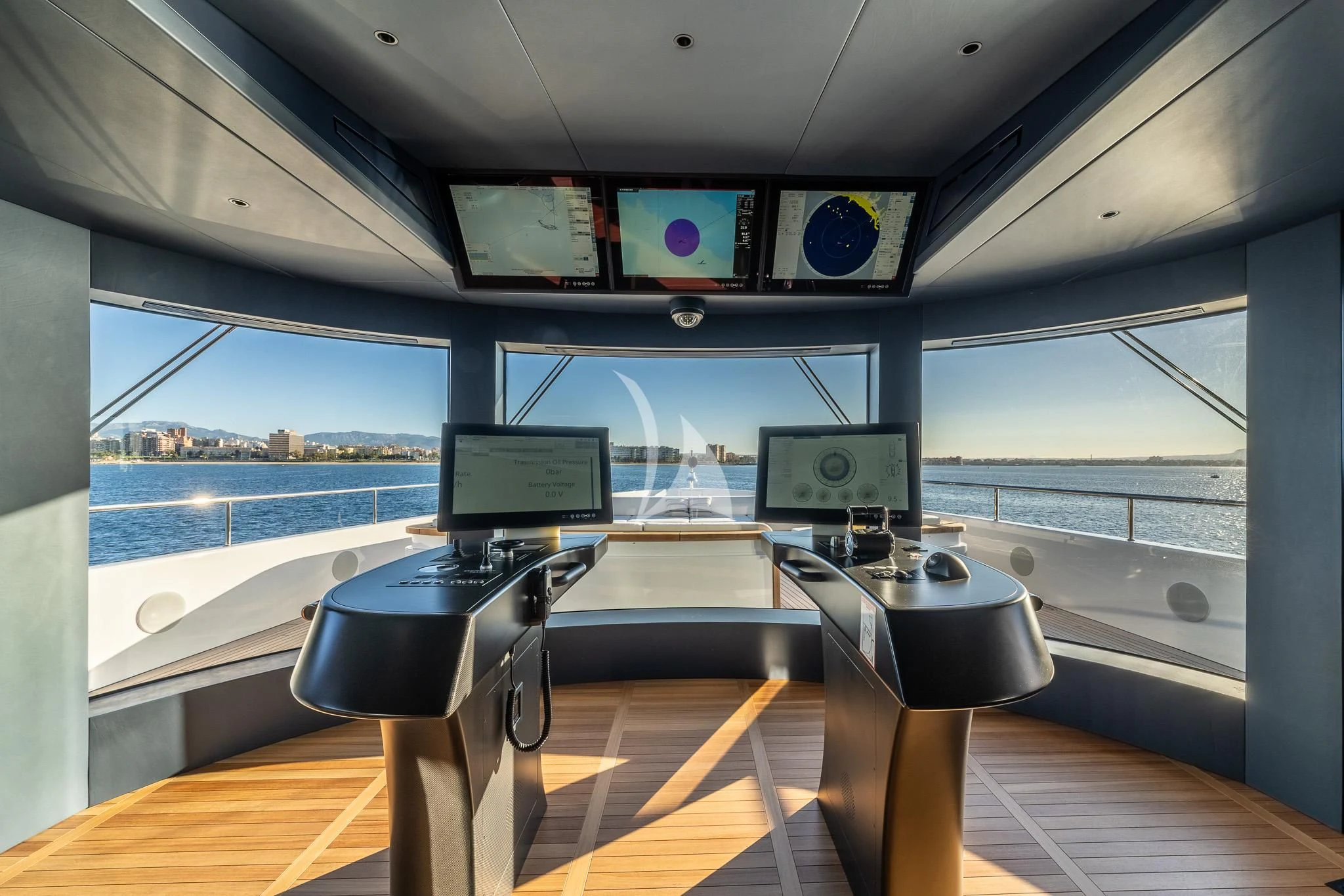 a room with a table and chairs aboard TOSUN Yacht for Sale