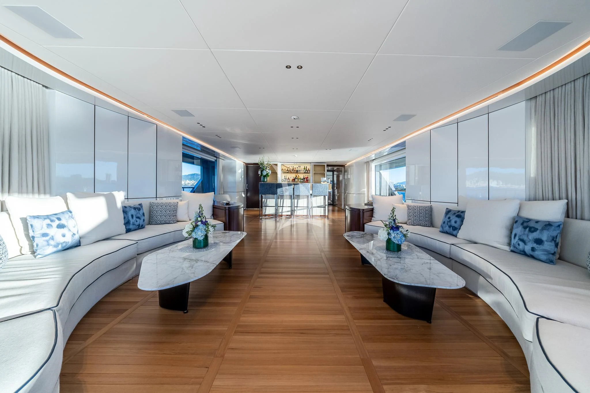 a living room with a wood floor aboard TOSUN Yacht for Sale
