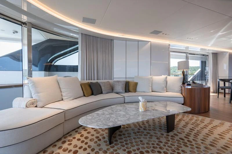 a living room with a couch and a coffee table aboard TOSUN Yacht for Sale