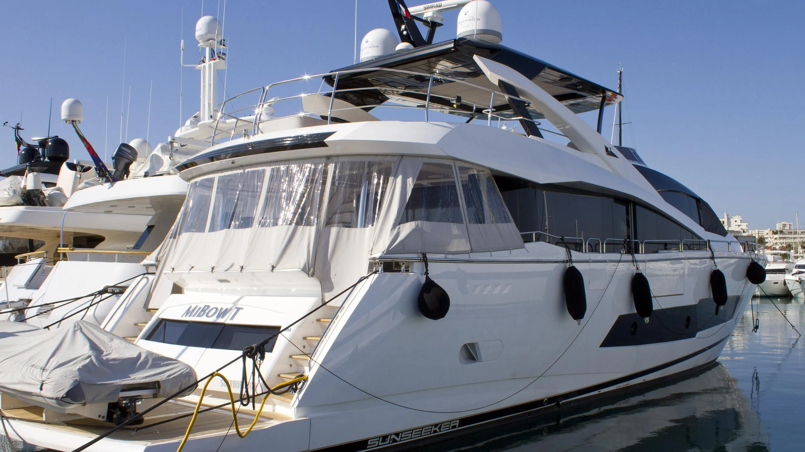 a white yacht docked aboard RIANNA Yacht for Sale