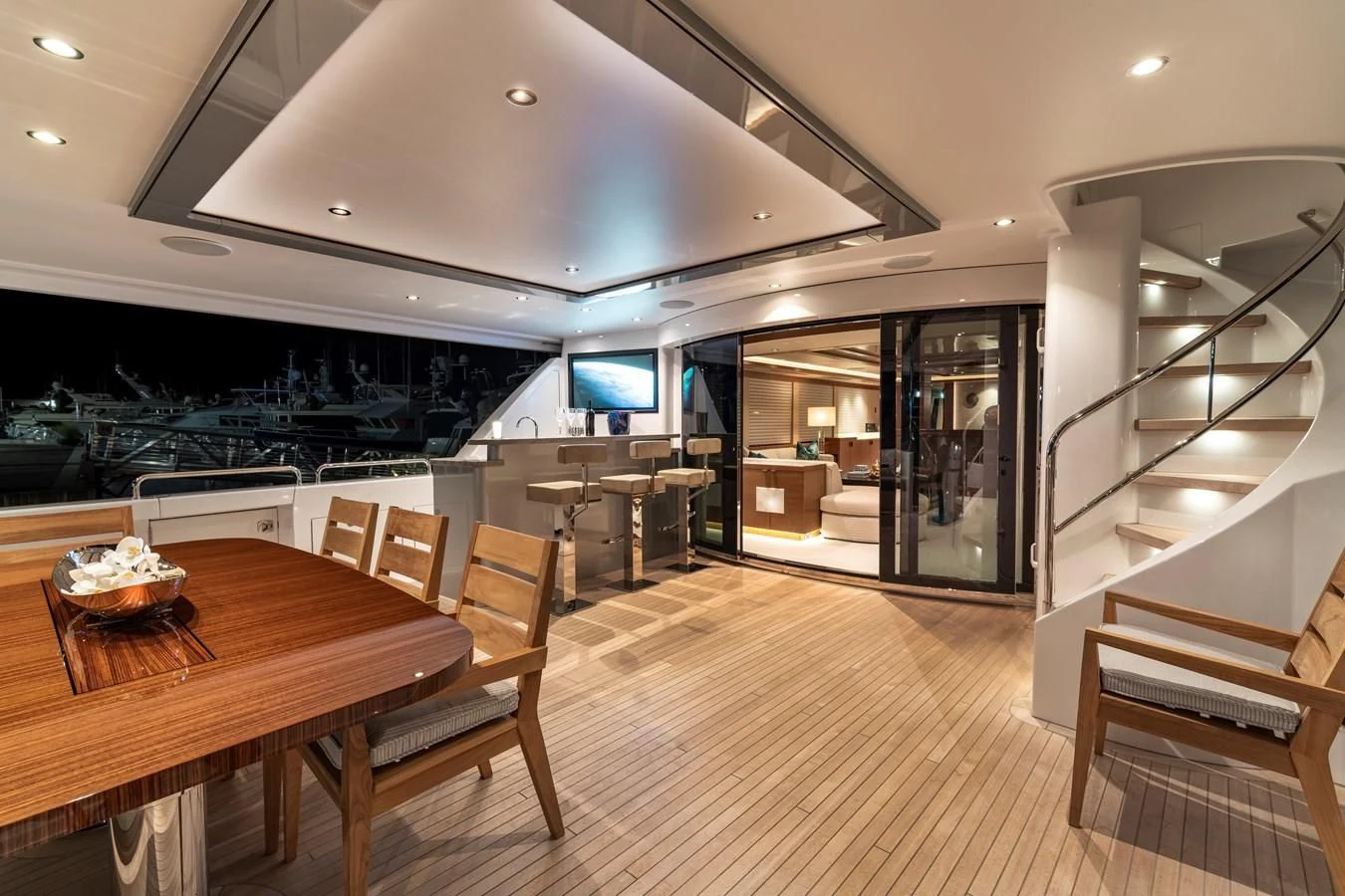 a room with a table and chairs aboard WESTPORT 112 #7766 Yacht for Sale