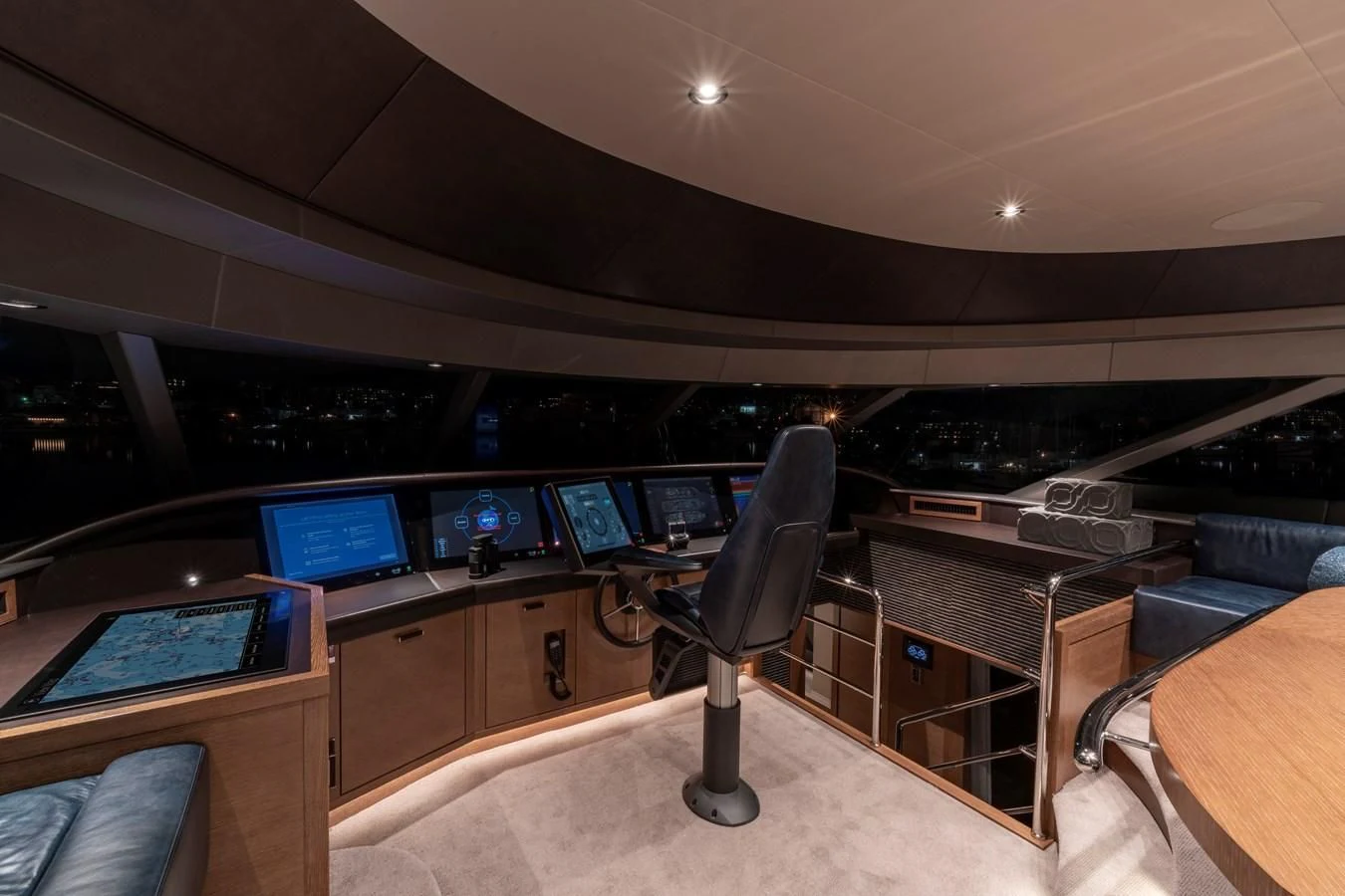 a room with a desk and chairs aboard WESTPORT 112 #7766 Yacht for Sale