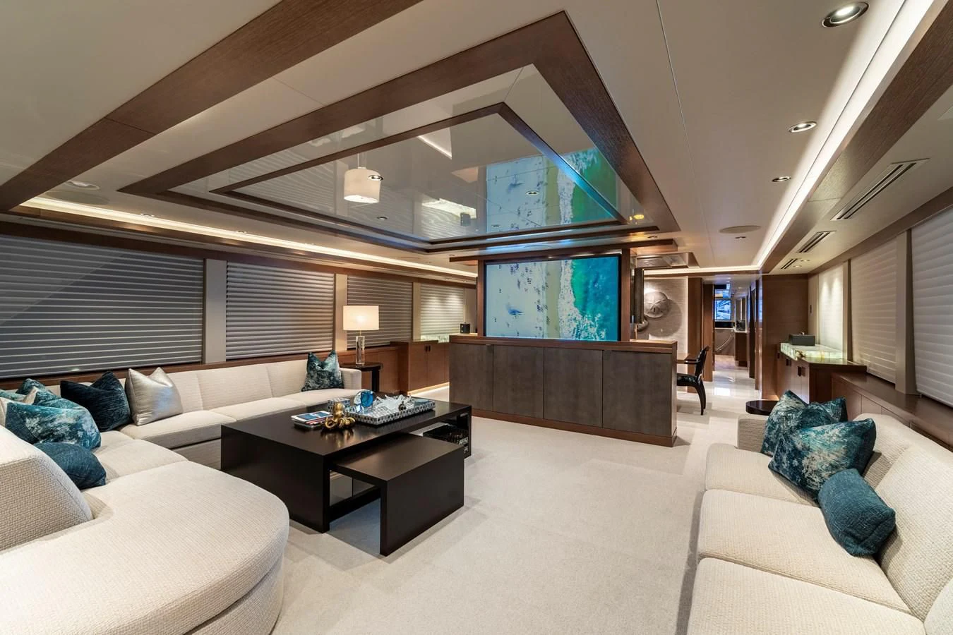 a living room with a large window aboard WESTPORT 112 #7766 Yacht for Sale