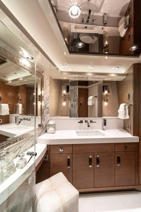 a bathroom with a large mirror aboard WESTPORT 112 #7766 Yacht for Sale